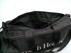 Opened Zippers on a Black duffel bag with 'Touch Holder' branding on a white background